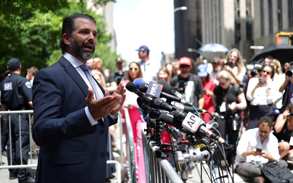 Donald Trump Jr., son of the former US president, speaks to the media outside Manhattan Criminal Court while the trial breaks for lunch