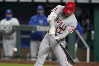 Los Angeles Angels designated hitter Shohei Ohtani hits a solo home run off Kansas City Royals starting pitcher Danny Duffy during the fifth inning of a baseball game at Kauffman Stadium in Kansas City, Mo., Tuesday, April 13, 2021. (AP Photo/Orlin Wagner)