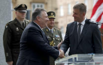 U.S. Secretary of State Mike Pompeo, front left, shakes hands with Czech Republic's Foreign Minister Tomas Petricek, right, during a ceremony at the General Patton memorial in Pilsen near Prague, Czech Republic, Tuesday, Aug. 11, 2020. U.S. Secretary of State Mike Pompeo is in Czech Republic at the start of a four-nation tour of Europe. Slovenia, Austria and Poland are the other stations of the trip. (AP Photo/Petr David Josek, Pool)