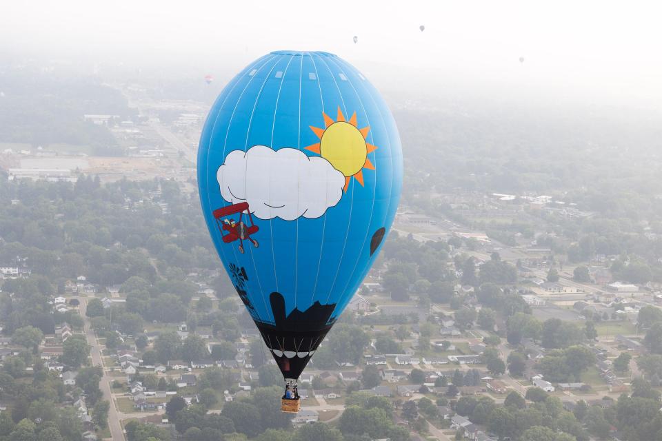 A balloon floats Friday morning above Stark County as part of the 2023 Balloon Classic.