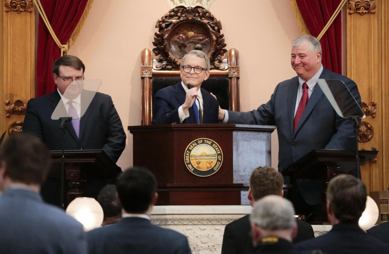 Flanked by then Senate President Larry Obhof, R-Medina (left) and former House Speaker Larry Householder, R-Glenford, Gov. Mike DeWine delivered his inaugural State of the State address in House chambers in 2019. Householder is now in prison for the House Bill 6 scandal, but many other officials remain unscathed.