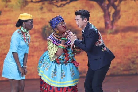 Chinese actor Lou Naiming (C) performs a skit on a Lunar New Year gala in Beijing, China, February 15, 2018. Picture taken February 15, 2018. REUTERS/Stringer