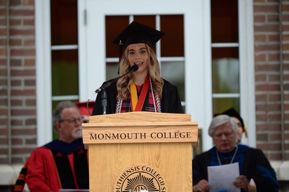 Monmouth College senior Elizabeth Gustafson of Kewanee, Illinois, addresses her fellow Class of 2022 graduates on Sunday afternoon on the College's Wallace Hall Plaza. A summa cum laude graduate, Gustafson was Monmouth's Student Laureate of the Lincoln Academy of Illinois.