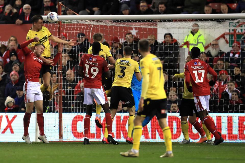 Matt Smith heads home his third of the night  Photo: PA