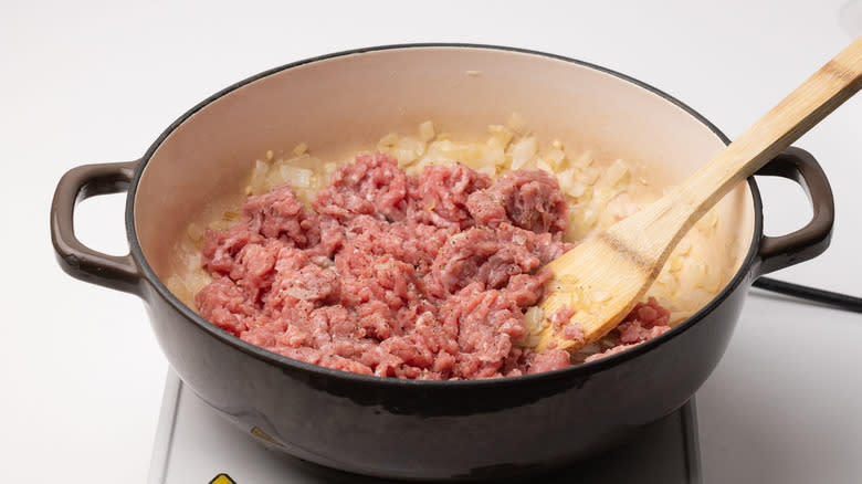 ground turkey cooking in a pan