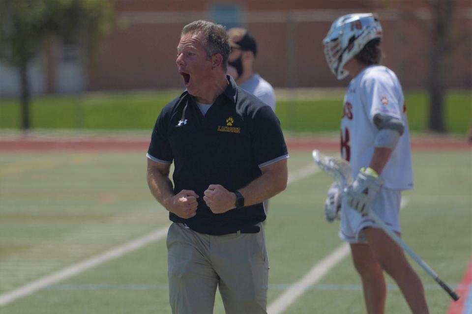 Poudre School District boys lacrosse coach Will Cantwell celebrates a goal during a 5A second-round playoff game against Rock Canyon on Saturday. No. 7 PSD beat No. 10 Rock Canyon 10-7 to advance to the quarterfinals.