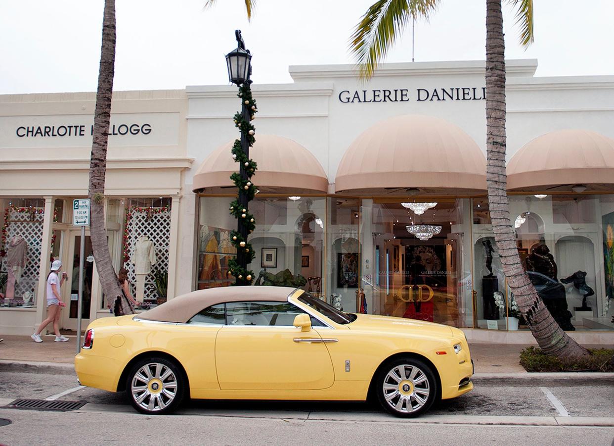 The yellow Rolls-Royce driven by gallery owner Daniel Bouaziz is parked in front of Galerie Danieli on Worth Avenue on Tuesday.