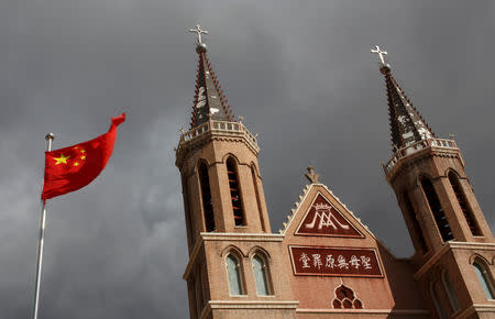 The Chinese national flag flies in front of a Catholic underground church in the village of Huangtuang, Hebei province, China, September 30, 2018. REUTERS/Thomas Peter