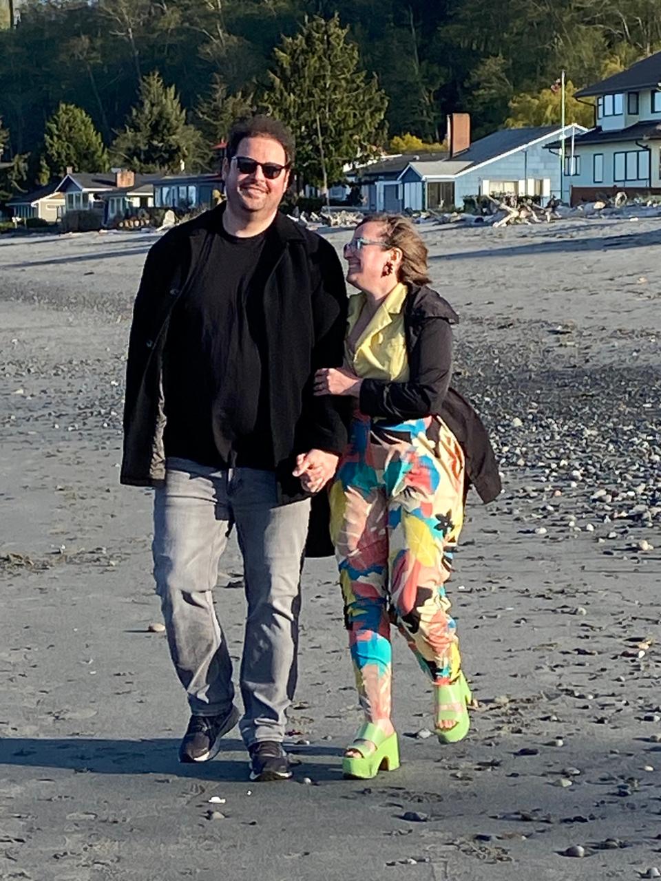 Author Adam Fuller and his wife, Amanda Allen, also a writer, walk along the beach at Norwegian Point Park in Hansville.