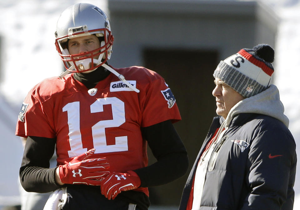 FILE - New England Patriots quarterback Tom Brady, left, stands with head coach Bill Belichick, right, during an NFL football practice, Thursday, Jan. 18, 2018, in Foxborough, Mass. Without Bill Belichick, Tom Brady won his seventh Super Bowl and is on pace to throw a career-high 53 touchdown passes at age 44. Without Brady under center, Belichick is 54-61 over his career, including 8-11 since the future Hall of Fame quarterback left New England for Tampa Bay. (AP Photo/Steven Senne, file)