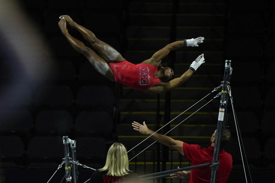 CAPTION CORRECTION CORRECTS SPORT: Simone Biles, a seven-time Olympic medalist and the 2016 Olympic champion, practices on the uneven bars at the U.S. Classic gymnastics competition Friday, Aug. 4, 2023, in Hoffman Estates, Ill. (AP Photo/Morry Gash)