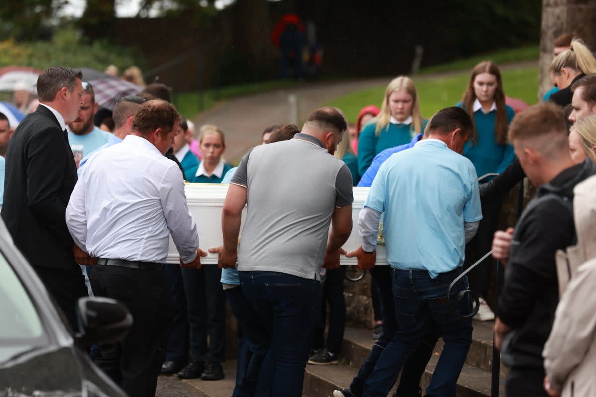 The coffin of Kiea McCann is carried into  the Sacred Heart Chapel in Clones (PA)