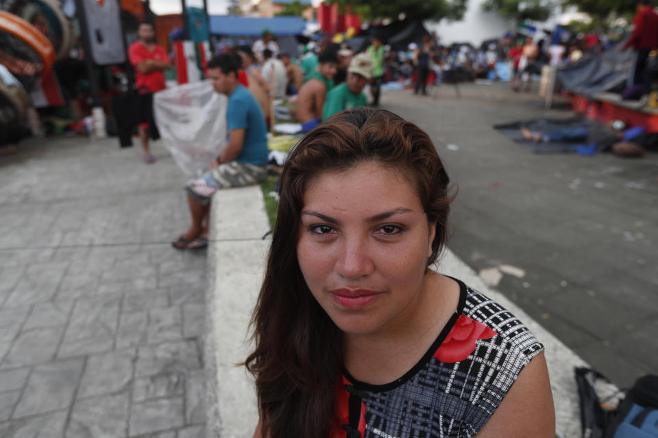 Honduran migrant Alba Rosa Chinchilla Ortiz poses for photos at a temporary shelter in the central park of Huixtla, Mexico, Tuesday, Oct. 23, 2018. Chinchilla's husband, an ex-soldier in the Honduran army has survived three attempts to kill him, Chinchilla said. Her partner of six years, he has applied for asylum in the United States and she's trying to join him and their son. (AP Photo/Moises Castillo)