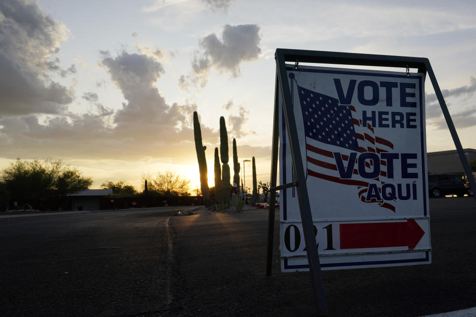 The sun sets at a local polling station Tuesday, Nov. 3, 2020 in Tucson, Ariz. (AP Photo/Ross D. Franklin)