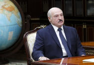 FILE - In this Monday, June 1, 2020 file photo, Belarusian President Alexander Lukashenko meets with Valery Vakulchik, chief of the Belarusian state security service, KGB, in Minsk, Belarus. Lukashenko said Friday, June 19, 2020 that his government has thwarted plans to destabilize Belarus ahead of a presidential vote in August, a statement that follows the detention of his top challenger, Viktor Babariko, the former head of Russia-owned Belgazprombank.(Nikolai Petrov/BelTA Pool Photo via AP, File)