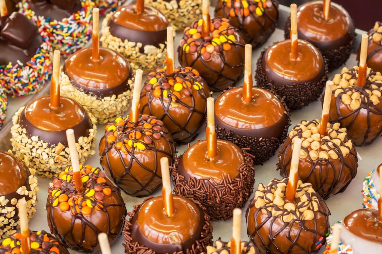 Tray of assorted candy apples at a state fair