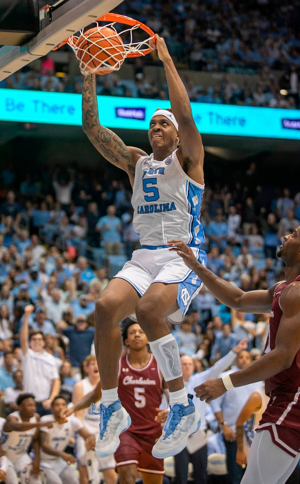 North Carolina’s Armando Bacot (5) dunks over College of Charleston’s Jaylon Scott (21) in the second half on Friday, November 11, 2022 at the Smith Center in Chapel Hill, N.C. Bacot lead all scores with 28 points in the Tar Heels’ 102-86 victory.