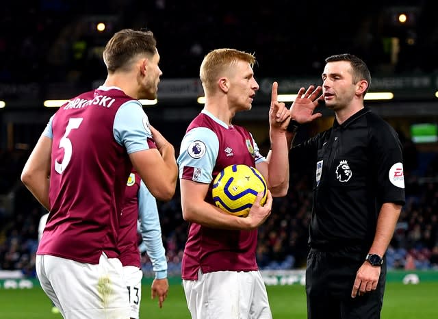 Michael Oliver awaits a VAR decision