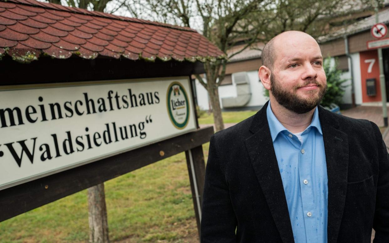 Stefan Jagsch of the far right-wing extremist National Democratic Party (NDP) poses for a photo in from of the community house in Altenstadt-Waldsiedlung, on September 8, 2019 - DPA