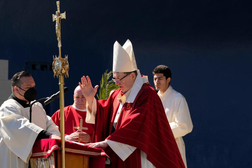 Cardinal Tobin (right arm raised)) is shown on Palm Sunday, at Veterans Field, in Ridgewood. Sunday, April 2, 2023