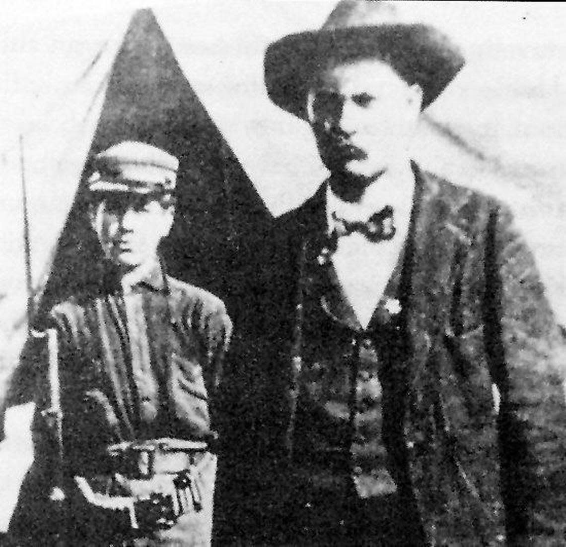 Thomas Baker, shown here in June 1899 with a soldier who was part of a state detachment guarding him as he faced a murder charge, was shot to death soon after the photo was taken.