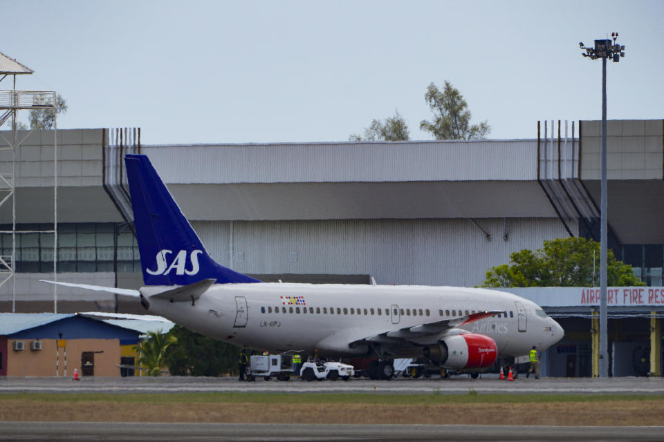 A Scandinavian Airlines medevac plane arrives at Langkawi, where the Norwegian king is being treated for an infection, in Malaysia, Friday, March 1, 2024. King Harald V, Europe's oldest monarch at 87, was hospitalized after he fell ill during a vacation, the royal palace in Oslo announced Tuesday. (AP Photo/Vincent Thian)