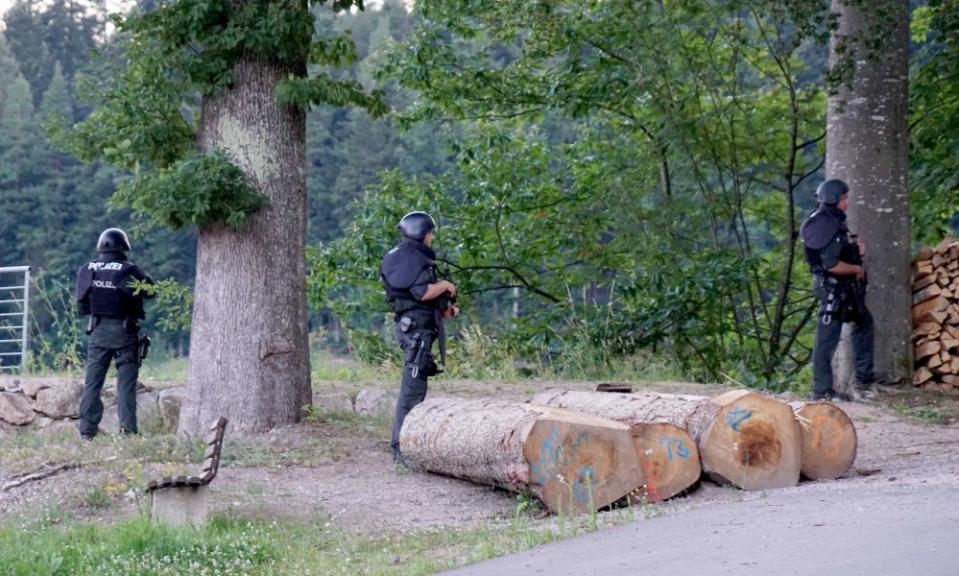 Police officers patrol near a road near Oppenau, Germany, earlier this week.