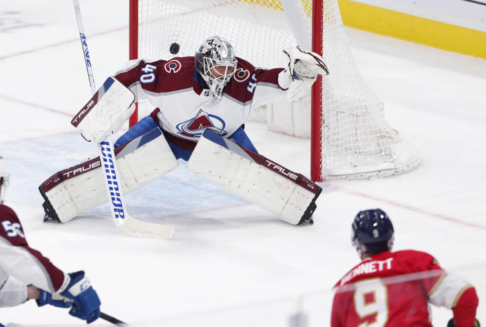 Florida Panthers center Sam Bennett (9) shoots over the shoulder of Colorado Avalanche goaltender Alexandar Georgiev (40) for a goal during the second period of an NHL hockey game Saturday, Feb. 11, 2023, in Sunrise, Fla. (AP Photo/Reinhold Matay)