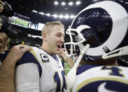 Los Angeles Rams' Jared Goff, left, celebrates with Greg Zuerlein after a game-winning field goal during overtime of the NFL football NFC championship game against the New Orleans Saints Sunday, Jan. 20, 2019, in New Orleans. The Rams won 26-23. (AP Photo/David J. Phillip)