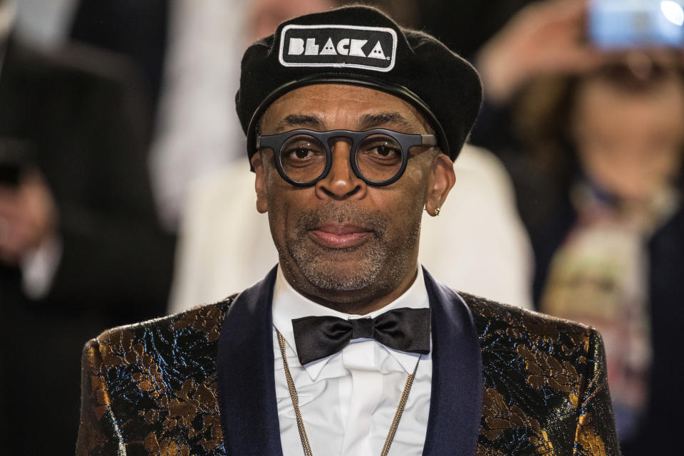 FILE - In this May 14, 2018 file photo, Spike Lee appears after the premiere of his film "BlacKkKlansman" at the 71st international film festival, Cannes, southern France. Lee is releasing his latest film this weekend, a year after the violent clashes in Charlottesville in which anti-racism activist Heather Heyer was run over and killed. Lee’s film is about an earlier chapter in white supremacism and the Ku Klux Klan: when African-American police detective Ron Stallworth infiltrated a Colorado Springs, Colorado, chapter of the KKK in 1979. (Photo by Vianney Le Caer/Invision/AP, File)