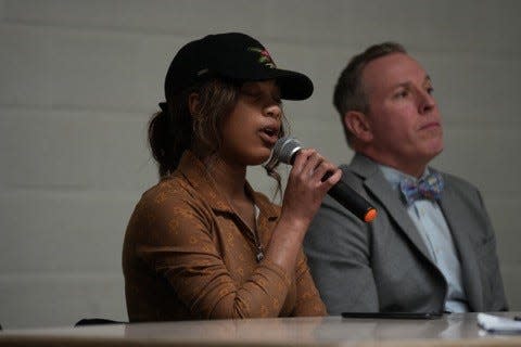 Seventeen-year-old Helen Mims sings "Hold On" at a youth town hall for teens and families on Monday, Feb. 13, 2023 at the Masonic Lodge at Sixth Avenue in Des Moines.