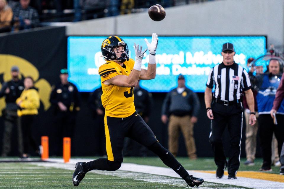 Iowa defensive back Cooper DeJean (3) catches a punt at Kinnick Stadium on Saturday, Oct. 21, 2023, in Iowa City, Iowa. DeJean returned the punt for a touchdownm and it was later called back after review ruled he fair-caught the punt.