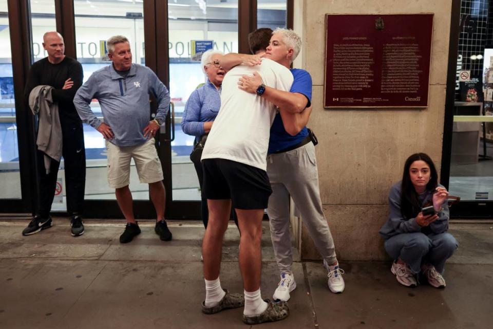Kentucky freshman Reed Sheppard hugged his mom, former UK basketball star Stacey Reed Sheppard, after his breakout performance Thursday night. At far left is Reed’s father, Jeff, who also starred for the Wildcats.