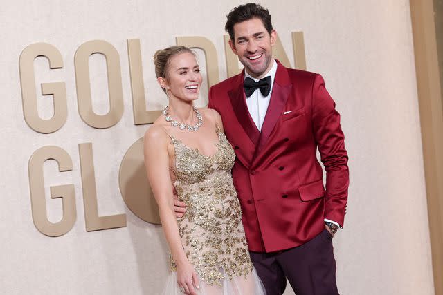 <p>John Salangsang/Getty</p> Emily Blunt in Alexander McQueen and John Krasinski in a red tux at the 2024 Golden Globes