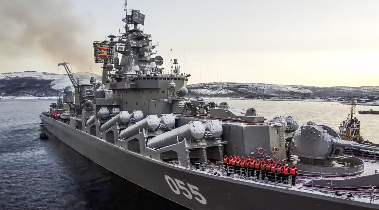 In this photo taken from video and released by the Russian Defense Ministry Press Service on Wednesday, Jan. 26, 2022, the Russian navy's missile cruiser Marshal Ustinov sails off for an exercise in the Arctic. Russia has launched a series of drills amid the tensions over Ukraine and deployed an estimated 100,000 troops near the Ukrainian territory that fueled Western fears of an invasion. (Russian Defense Ministry Press Service via AP)