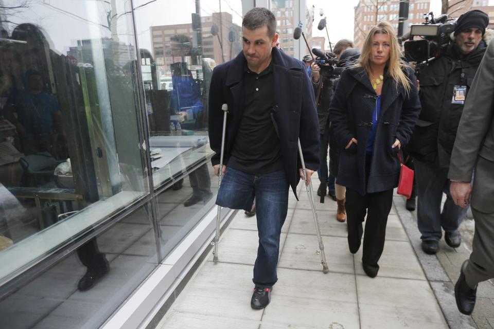 Boston Marathon bombing survivor Marc Fucarile (L) leaves the federal courthouse on the first day of the trial of accused bomber Dzhokhar Tsarnaev in Boston, Massachusetts March 4, 2015. REUTERS/Brian Snyder (UNITED STATES - Tags: CRIME LAW)