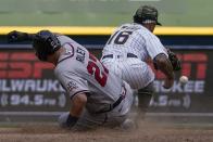 Atlanta Braves' Austin Riley is safe at second as Milwaukee Brewers' Kolten Wong can't handle the throw during the eighth inning of a baseball game Sunday, May 16, 2021, in Milwaukee. (AP Photo/Morry Gash)