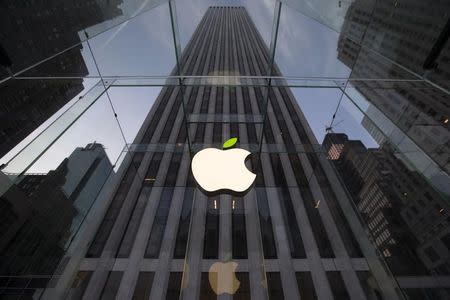 The leaf on the Apple symbol is tinted green at the Apple flagship store on 5th Ave in New York April 22, 2014. REUTERS/Brendan McDermid