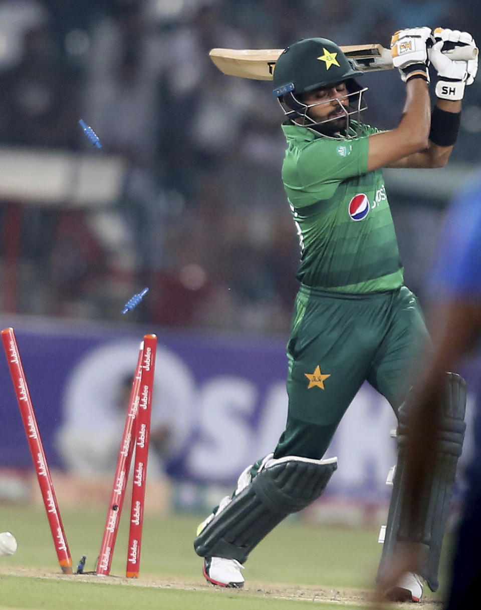 Pakistan's Babar Azam is dismissed by Sri Lankan bowler during the second Twenty20 match between Pakistan and Sri Lanka in Lahore, Pakistan, Monday, Oct. 7, 2019. Sri Lanka won the toss and elected to bat in the second Twenty20 against Pakistan. (AP Photo/K.M. Chaudary)
