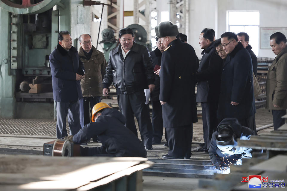 This undated photo provided on Feb. 2, 2024, by the North Korean government, North Korean leader Kim Jong Un, center, visits a shipyard in Nampho, North Korea. Independent journalists were not given access to cover the event depicted in this image distributed by the North Korean government. The content of this image is as provided and cannot be independently verified. Korean language watermark on image as provided by source reads: "KCNA" which is the abbreviation for Korean Central News Agency. (Korean Central News Agency/Korea News Service via AP)