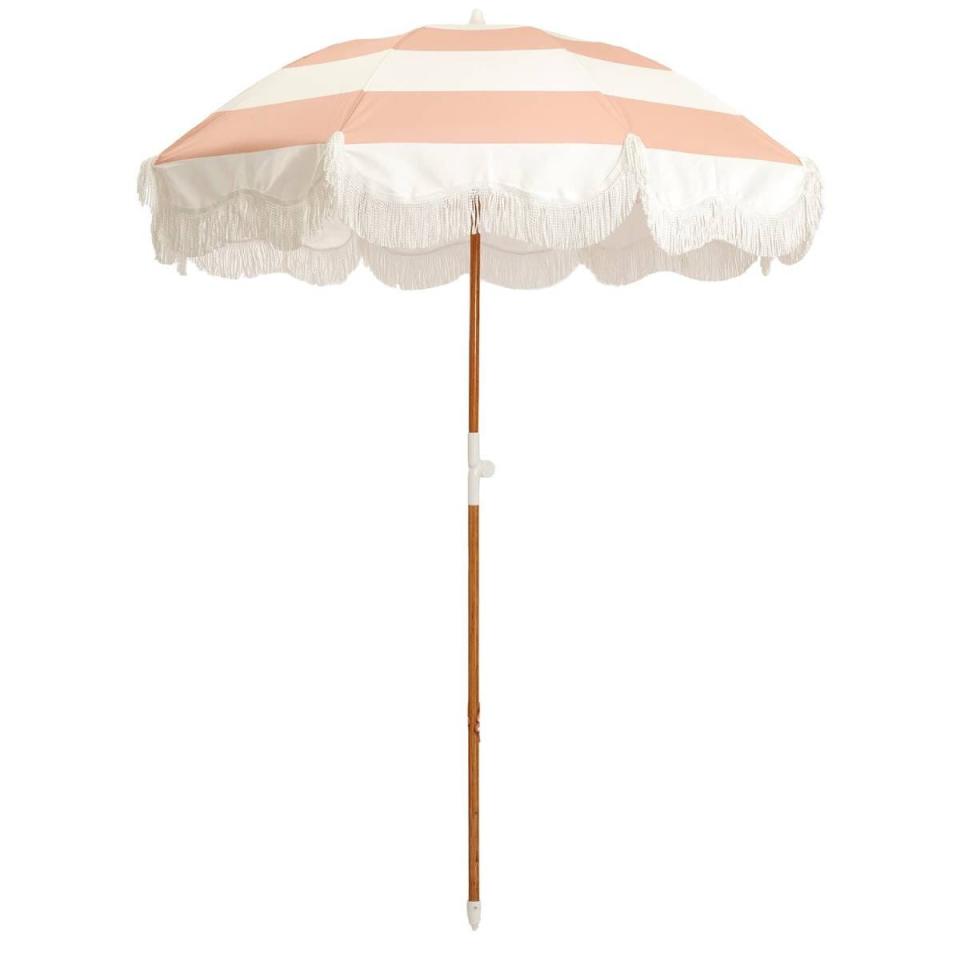 <p><a href="https://businessandpleasureco.com/products/the-holiday-beach-umbrella-pink-capri-stripe?_pos=18&_sid=491c0f7f2&_ss=r" rel="nofollow noopener" target="_blank" data-ylk="slk:Shop Now;elm:context_link;itc:0;sec:content-canvas" class="link ">Shop Now</a></p><p>Beach Umbrella in Pink Capri Stripe</p><p>businessandpleasureco.com</p><p>$199.00</p>