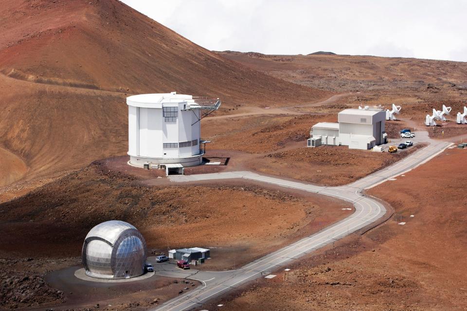 In this Aug. 31, 2015, file photo, from bottom left, the Caltech Submillimeter Observatory, the James Clerk Maxwell Telescope and the Submillimeter Array, far right, are shown on Hawaii's Mauna Kea near Hilo, Hawaii.