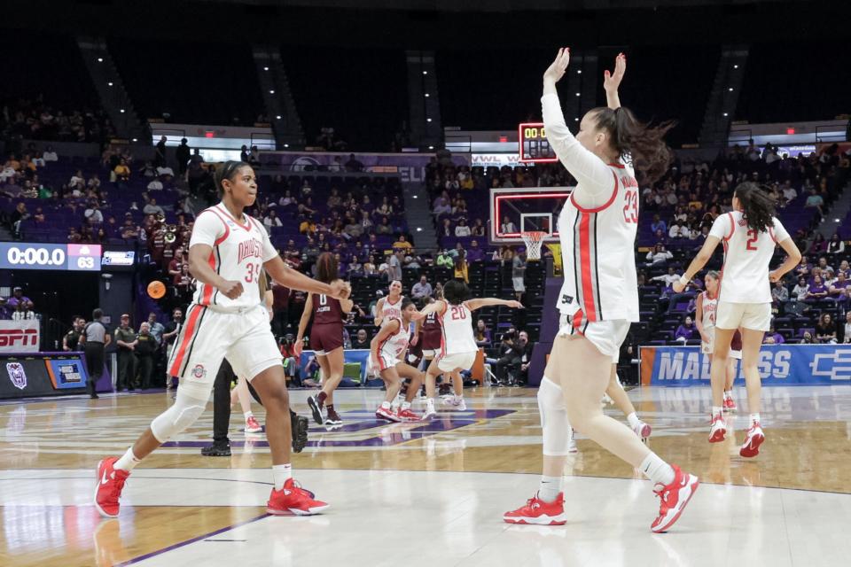 Ohio State's Rebeka Mikulasikova (right) celebrates with Tanaya Beacham after the Buckeyes defeated Missouri State on Saturday.