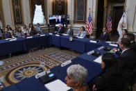 President Joe Biden speaks virtually from the Indian Treaty Room on the White House complex in Washington, Wednesday, Aug. 3, 2022, on securing access to reproductive and other health during the first meeting of the interagency Task Force on Reproductive Healthcare Access. Vice President Kamala Harris, third from right, and other administration officials listen. (AP Photo/Susan Walsh)