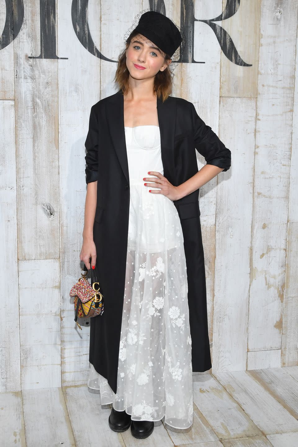 <p><strong>25 May </strong>Natalia Dyer layered an elongated blazer over a delicate white dress, teamed with a veiled hat. </p>