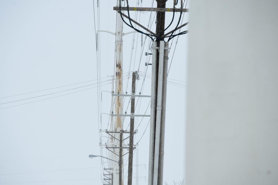 Power lines run power from the Carroll McDonald Substation during winter weather in Lubbock.