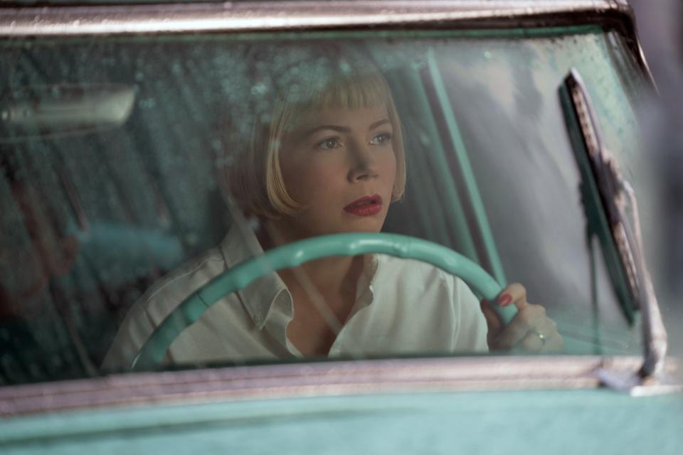 Michelle Williams drives a car