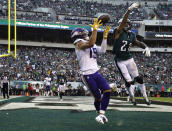 FILE - Minnesota Vikings' Adam Thielen (19) catches a touchdown against Philadelphia Eagles' Ronald Darby (21) during the first half of an NFL football game, Sunday, Oct. 7, 2018, in Philadelphia. The coronavirus pandemic scuttled most college pro days, wiped out all rookie minicamps and obliterated the NFL's traditional offseason. Thielen went undrafted in 2013 out of Minnesota State but parlayed an impressive weekend at a rookie minicamp into a practice squad job and eventually a roster spot. (AP Photo/Matt Rourke, File)