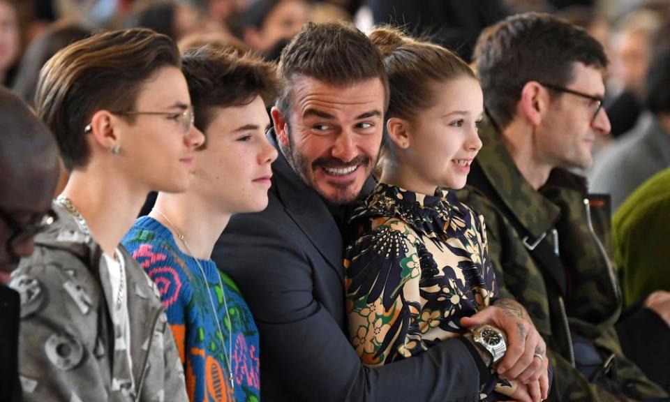 The Beckhams (Romeo, Cruz, David and Harper) on the front row for the Victoria Beckham catwalk show . Photograph: Daniel Leal-Olivas/AFP via Getty Images