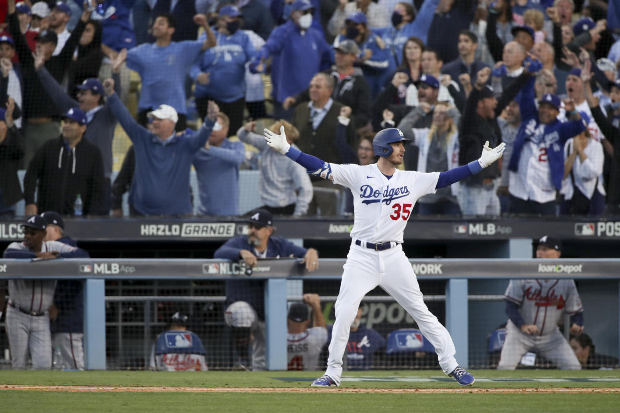 Los Angeles, CA - October 19: Los Angeles Dodgers' Cody Bellinger celebrates after hitting the game-tying three-run home run during the eighth inning in game three in the 2021 National League Championship Series against the Atlanta Braves at Dodger Stadium on Tuesday, Oct. 19, 2021 in Los Angeles, CA. (Luis Sinco / Los Angeles Times via Getty Images)